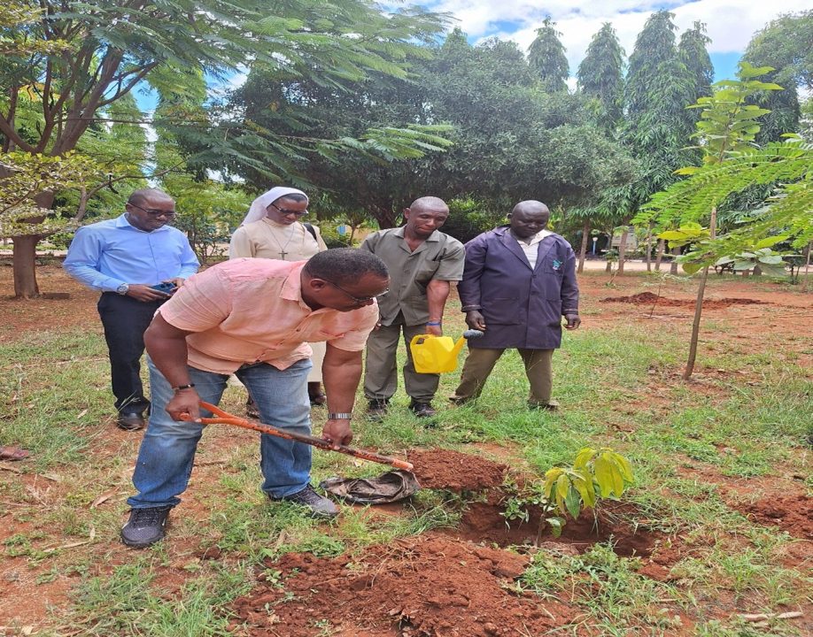 The KNATCOM Ag. SG - Dr James Njogu, HSC during the tree planting exercise